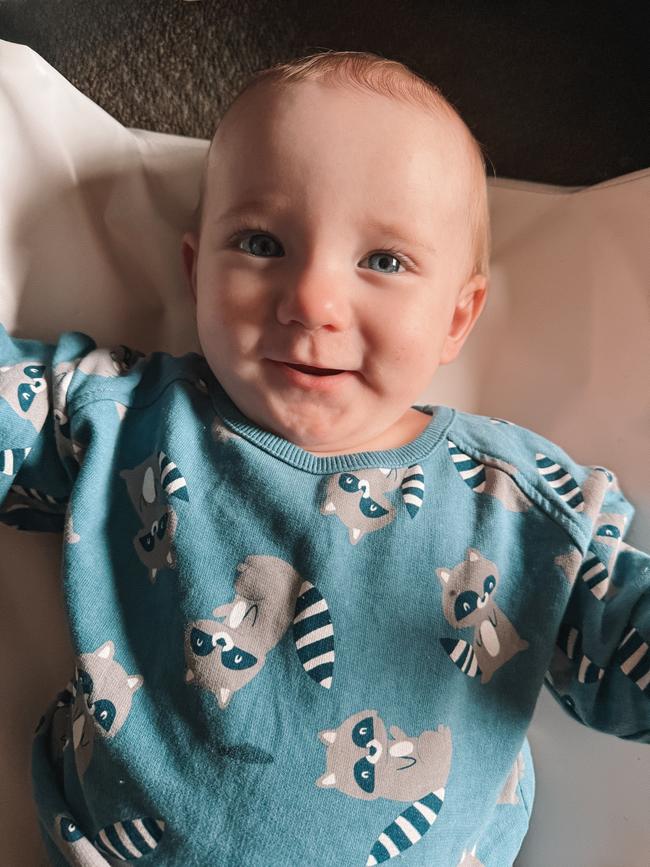 Sebastian McCaughan, nine months old. Loves crawling after his sister and making funny noises with her. Sebastian can be very shy so when you lock eyes with him, he’ll tuck his head away with a cute little smile.