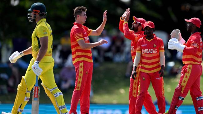 Zimbabwe's Brad Evans celebrates with his teammates, Photo by William WEST / AFP-