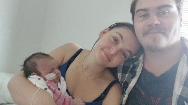 Raevyn Harper with her parents. Picture – GoFundMe.