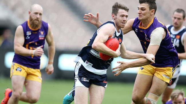 Lachlan Bramble in action during an interleague football game on the MCG.