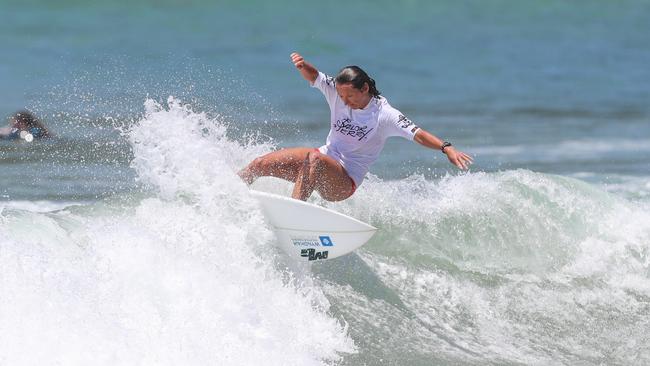 Layne Beachley, seven-time world champion, hits the surf.