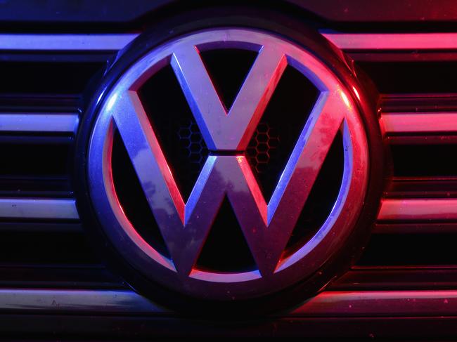 BERLIN, GERMANY - OCTOBER 06: The Volkswagen logo is visible under coloured lights on the front of a Volkswagen Passat 2.0 turbodiesel passenger car affected by the Volkswagen diesel emissions software scandal on October 6, 2015 in Berlin, Germany. Volkswagen has admitted that 8 million cars and light trucks in Europe alone are affected by the software the company deliberately installed in order to manipulate diesel emissions results under testing conditions. Since news of the issue broke two weeks ago Volkswagen's share price has dropped by over 40% and the company faces investigations and fines in countries across the globe. (Photo by Sean Gallup/Getty Images)