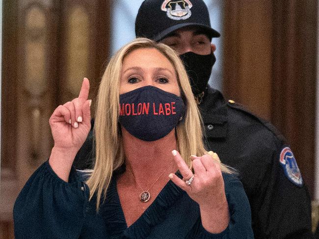 Representative Marjorie Taylor Greene shouts at journalists as she goes through security outside the House Chamber at Capitol Hill in Washington, DC this week. Picture: AFP