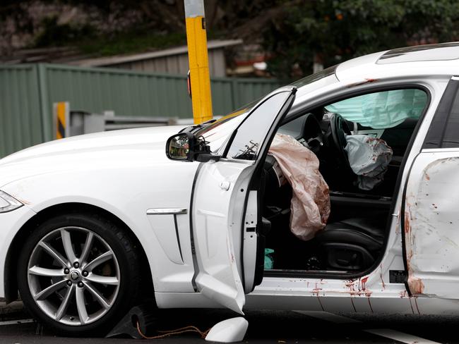 SYDNEY, AUSTRALIA - NewsWire Photos AUGUST 25, 2024: Blood can be seen inside this white car at a crime scene on the Princes Highway in Engadine where there was a car crash and stabbing incident.Picture: NewsWire / Damian Shaw