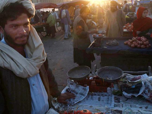 Vendor selling fruit in market in Kabul, Afghanistan 15 Nov 2001.