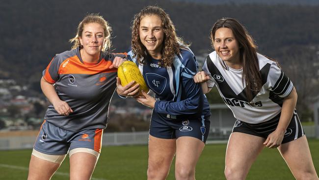 SFLW footballers (L-R) Jess Kube (South East Suns), Mandy Fish (Lindisfarne) and Katie Stanford (Claremont) ahead of the start of the season. Picture Chris Kidd