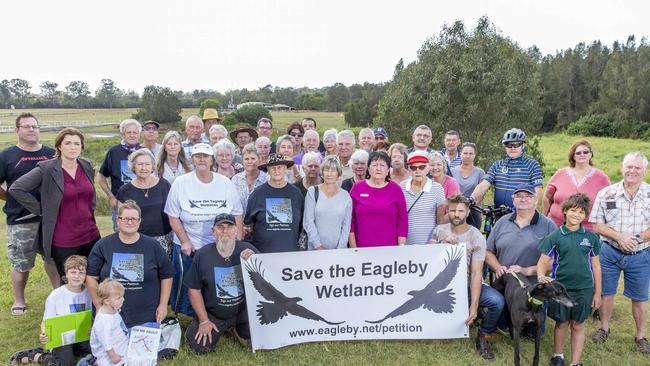 MACALISTER MP Melissa McMahon, second from left, with Eagleby residents angry over the proposed Coomera Connector road at the end of River Hills Road, Eagleby. AAP/Richard Walker