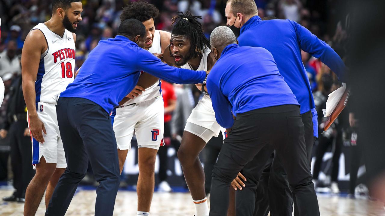 DETROIT, MICHIGAN - NOVEMBER 21: Isaiah Stewart #28 of the Detroit Pistons is restrained after receiving a blow to the face by LeBron James #6 of the Los Angeles Lakers during the third quarter of the game at Little Caesars Arena on November 21, 2021 in Detroit, Michigan. NOTE TO USER: User expressly acknowledges and agrees that, by downloading and or using this photograph, User is consenting to the terms and conditions of the Getty Images License Agreement. Nic Antaya/Getty Images/AFP == FOR NEWSPAPERS, INTERNET, TELCOS &amp; TELEVISION USE ONLY ==