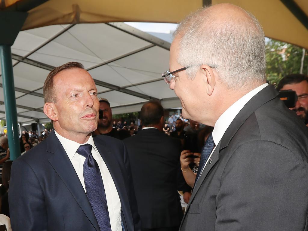 Scott Morrison and Tony Abbott cross paths at a Good Friday church service. Picture Gary Ramage