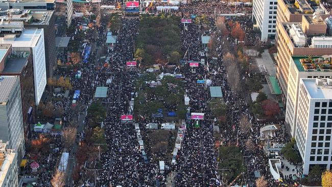 Protesters calling for the ouster of South Korea President Yoon Suk Yeol gathering to await the outcome of the second martial law impeachment vote in Seoul. Picture: AFP