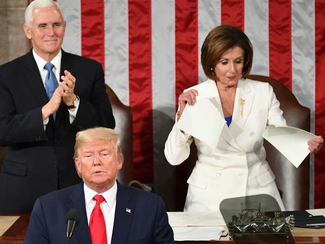 US Vice President Mike Pence claps as Speaker of the US House of Representatives Nancy Pelosi appears to rip a copy of US President Donald Trumps speech after he delivers the State of the Union address at the US Capitol in Washington, DC. Picture: AFP