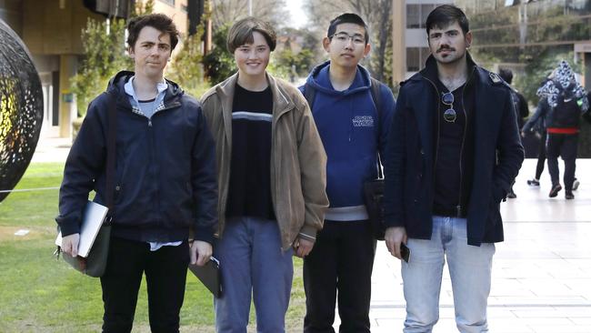 Students Gene Brownlie, Macy Reen, Paul Cheng and James Morched who would like to see the system changed.