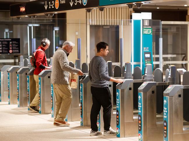 SYDNEY, AUSTRALIA - NewsWire Photos. August 19 2024. Commuters go through the opal payment gates at Martin Place Metro station on the opening day of the Sydney Metro. Picture: NewsWire / Max Mason-Hubers