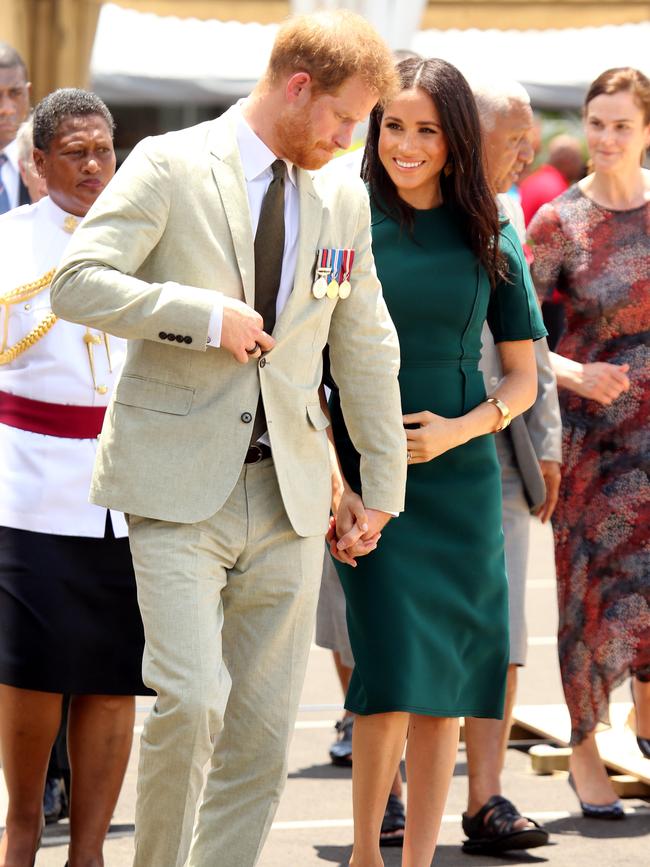 Meghan cradled her growing bump. Picture: Nathan Edwards