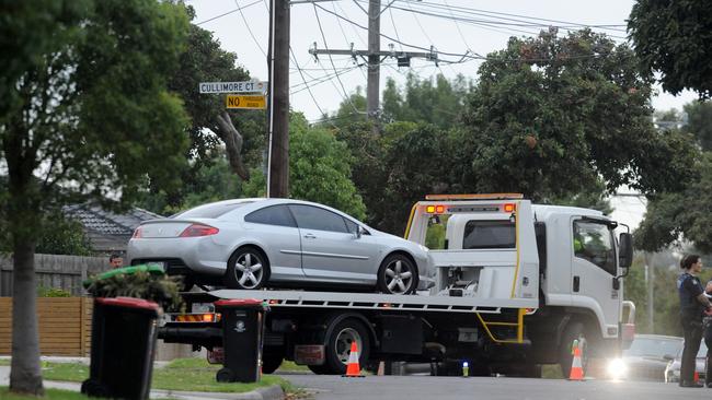 The car involved is towed from the scene. Picture: Andrew Henshaw