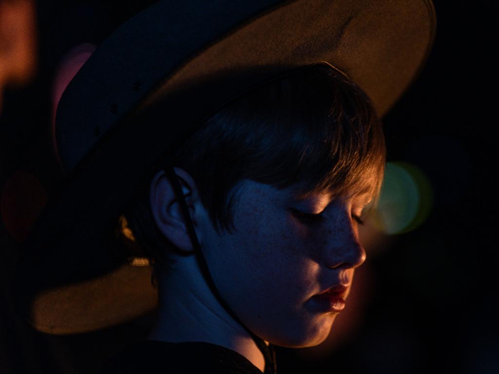 A child stands close to the Eternal Flame at the Shrine of Remembrance. Picture: Diego Fedele