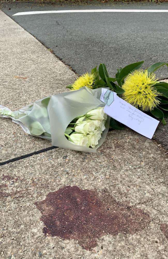 A floral tribute was left beside a blood stain following the fatal stabbing of a teenager at Redcliffe. Picture: Isabella Magee