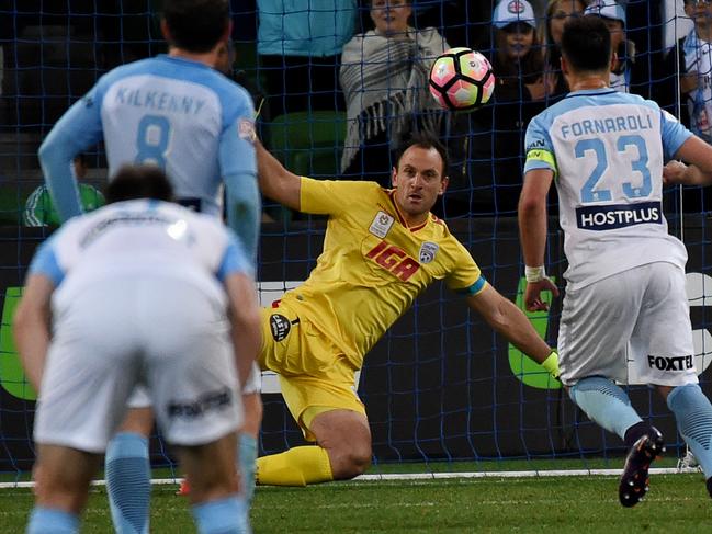 Eugene Galekovic of Adelaide defends as Bruno Fornaroli of Melbourne (right) scores a goal during the round 4 A-League match between Melbourne City and Adelaide United at AAMI Park in Melbourne, Friday, Oct. 28, 2016. (AAP Image/Tracey Nearmy) NO ARCHIVING, EDITORIAL USE ONLY