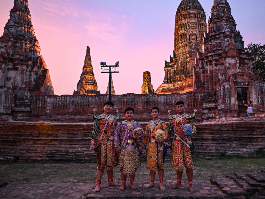 Thai artists in traditional costumes await the start of a “Khon” dance, at the 17th-century Wat Chaiwatthanaram in Bangkok. Picture: Manan Vatsyayana/AFP