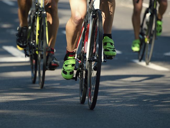 Cyclist athletes riding a race at high speed