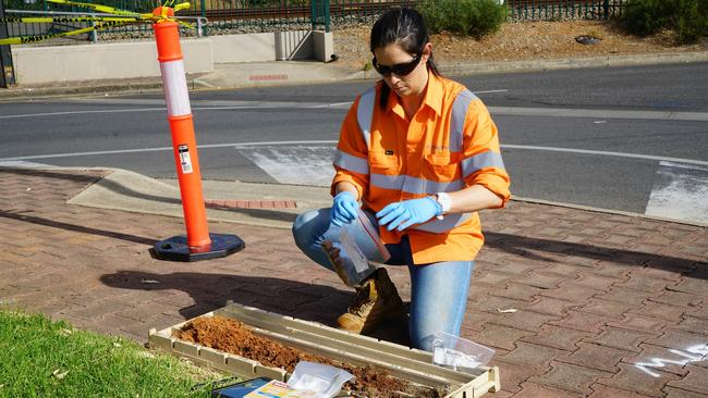 An Environment Protection Authority (EPA) officer tests soil for volatile organic compounds. 