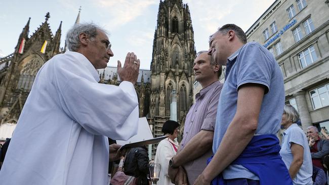 In 2023, the Vatican formally approved priests to be able to bless same-sex couples, including this public ceremony in front of the Cologne Cathedral in Germany. Picture: AP
