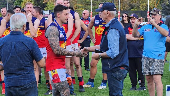 Jaidyn Caruana is awarded the Grumont Medal by Ross Grumont.