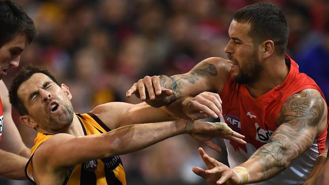 Luke Hodge and Lance Franklin face off.