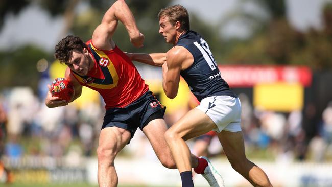 ADELAIDE, AUSTRALIA - APRIL 06: Jackson Callow of South Australia shrugs off Roarke Smith of Victoria during the 2024 AAMI State Game between SANFL West End State Team and Smithy's VFL State Team at Glenelg Oval, on April 06, 2024, in Adelaide, Australia. (Photo by Maya Thompson/AFL Photos/via Getty Images)