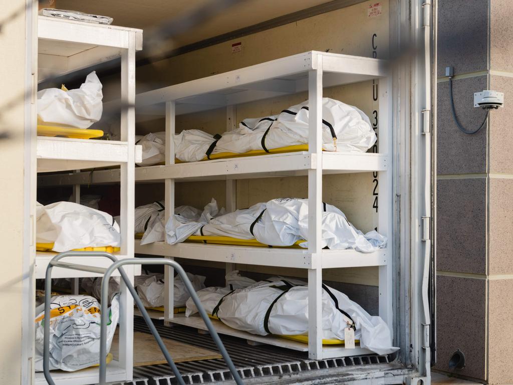 Bodies wrapped in plastic line the walls inside a refrigerated trailer used as a mobile morgue by the El Paso County Medical Examiner's office in El Paso, Texas. Picture: Justin Hamel/AFP