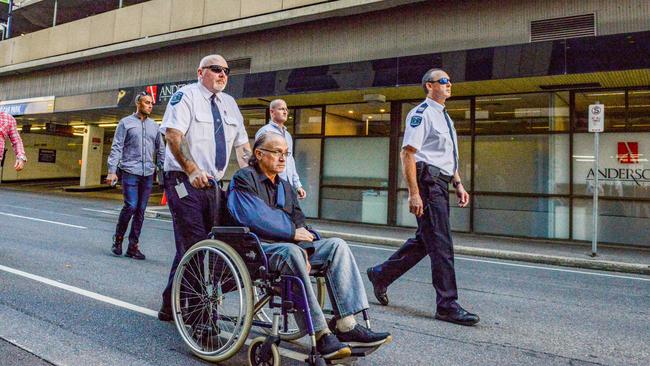 Alleged NCA bomber Domenic Perre taking a heavily-guarded walk around Adelaide’s streets. Picture: NCA NewsWire / Brenton Edwards