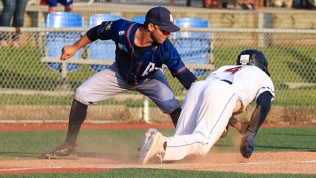 Adelaide Giants’ Mikey Reynolds tags Melbourne Aces’ DJ Burt during the clubs’ Australian Baseball League series. Picture: Tania Chalmers / SMP Images