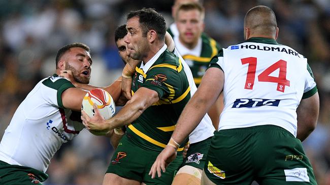 Cameron Smith of Australia offloads the ball.