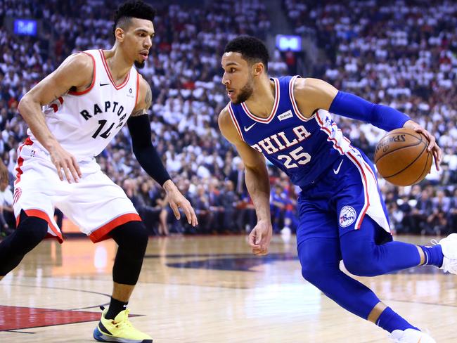 TORONTO, ON - MAY 07: Ben Simmons #25 of the Philadelphia 76ers dribbles the ball as Danny Green #14 of the Toronto Raptors defends in the first half during Game Five of the second round of the 2019 NBA Playoffs at Scotiabank Arena on May 7, 2019 in Toronto, Canada. NOTE TO USER: User expressly acknowledges and agrees that, by downloading and or using this photograph, User is consenting to the terms and conditions of the Getty Images License Agreement.   Vaughn Ridley/Getty Images/AFP == FOR NEWSPAPERS, INTERNET, TELCOS & TELEVISION USE ONLY ==