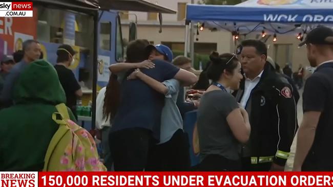 The couple could be seen comforting victims of the disaster.z Picture: CBS