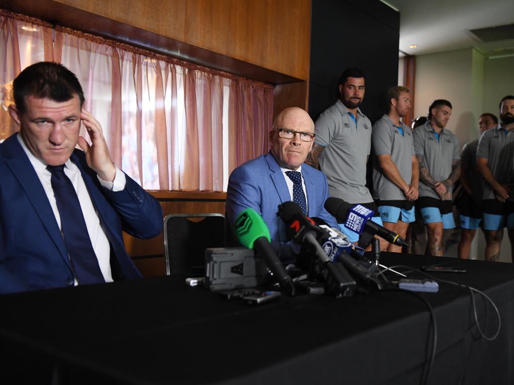 Cronulla Sutherland Sharks CEO Barry Russell and Sharks senior player Paul Gallen are joined by the senior players group as they address the media after Shane Flanagan was deregistered by the NRL and the club fined $800,000. Picture: AAP Image/Dean Lewins