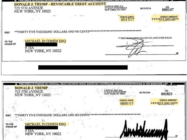 Michael Cohen shows the cheques he says show Donald Trump and Don Trump Jr’s signature. Picture: Supplied