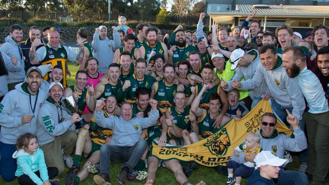 North Brunswick’s loyal supporters join their players to celebrate the club’s droughtbreaking premiership. Picture: VAFA media.