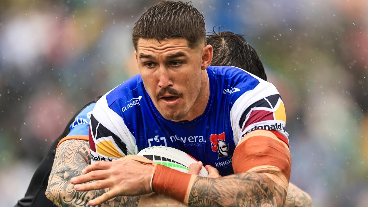 TAMWORTH, AUSTRALIA - MAY 11: Dylan Lucas of the Knights is tackled during the round 10 NRL match between Wests Tigers and Newcastle Knights at Scully Park, on May 11, 2024, in Tamworth, Australia. (Photo by Mark Evans/Getty Images)