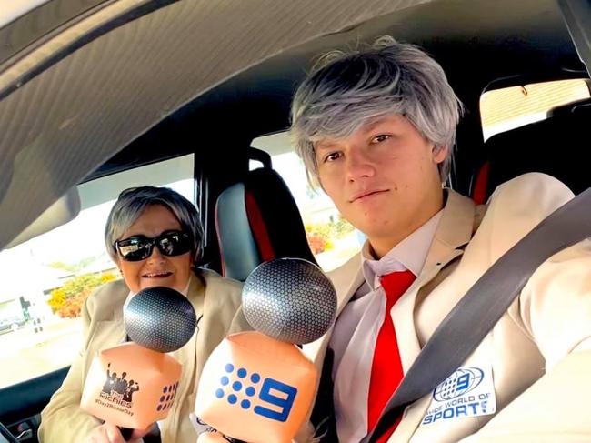 Charlie Mclennan and her son George dress up as Richie Benaud's at their Covid test. Credit: Facebook