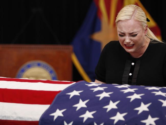 Meghan McCain, daughter of US Senator John McCain, grieves over the casket of her father during a memorial service at the Arizona Capitol. Picture: AFP