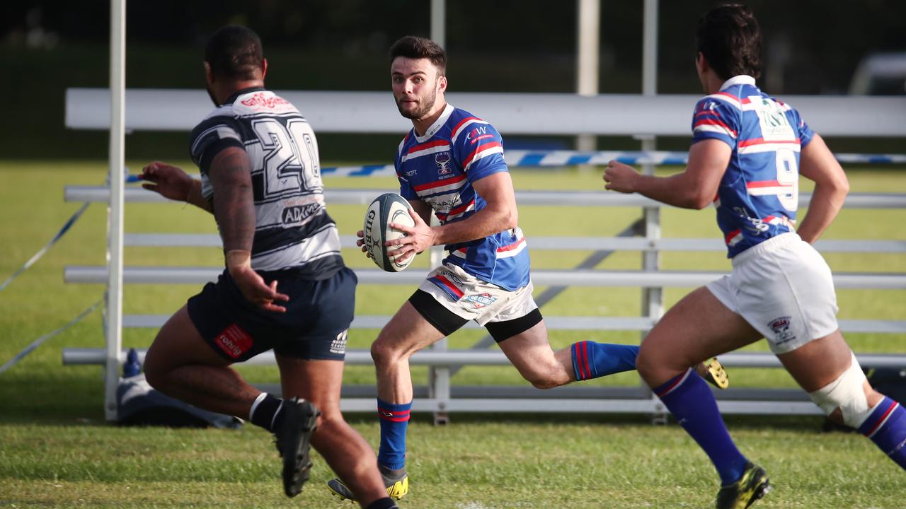 Duane Eramus runs the ball down the sideline in the FNQ Rugby match between the Barron Trinity Bulls and Cairns Brothers, held at Stan Williams Park, Manunda. PICTURE: BRENDAN RADKE