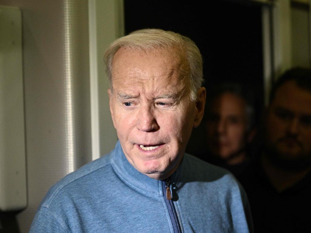 Joe Biden speaks to members of the media aboard Air Force One. Picture: Brendan Smialowski/AFP