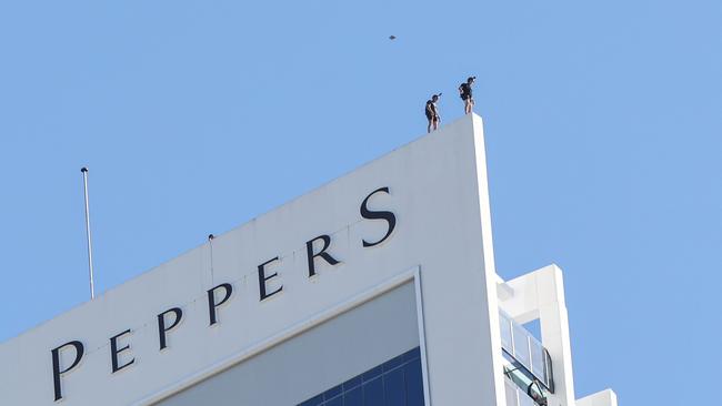 In a thrilling showcase to mark the 90-day countdown to the 2024 Pacific Airshow Gold Coast, two BASE umpers - Jackson Strong and a cameraman - launch off the Soul building. Picture: Adam Head