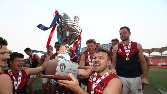 Demons premiership player Dan Green celebrates winning the 2019 QAFL grand final. Photo: Jason O'Brien Photography