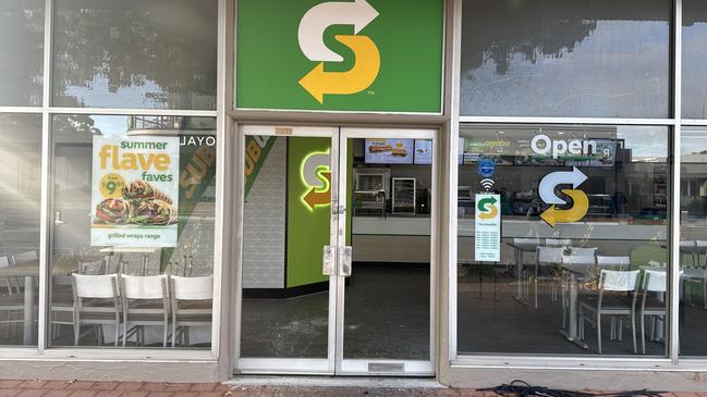 The glass door at a nearby Subway was smashed in overnight. Picture: Roy VanDerVegt