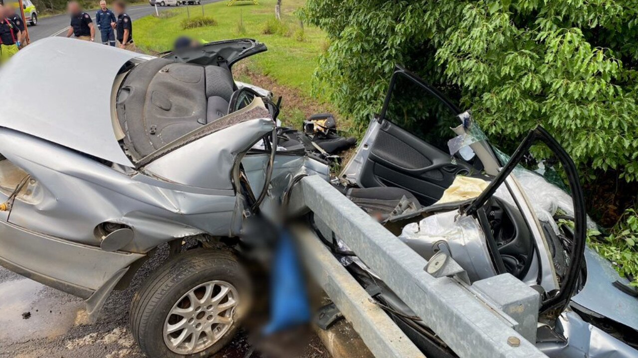 The sedan was left bearing down towards the ground below while firefighters worked to free the injured man. Photo: Sunshine Coast RACQ LifeFlight