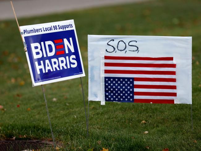 A Biden/Harris political lawn sign is seen on November 4, 2020 in West Bloomfield, Michigan. - President Donald Trump and Democratic challenger Joe Biden are battling it out for the White House, with polls closed across the United States -- and the American people waiting for results in key battlegrounds still up for grabs. (Photo by JEFF KOWALSKY / AFP)