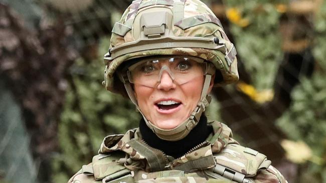 Britain's Catherine, Princess of Wales reacts as she flies a drone during a visit to the 1st The Queen's Dragoon Guards (QDG), near Norwich, eastern England on November 8, 2023. (Photo by CHRIS RADBURN / POOL / AFP)