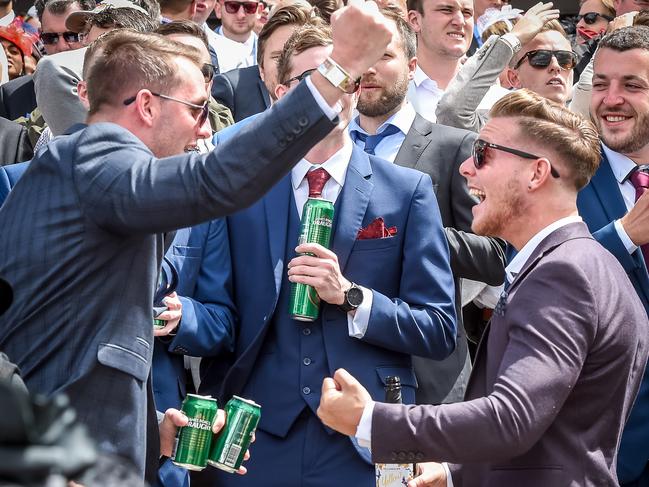 Melbourne Cup. 2016. Flemington. Punters celebrate a win in race 3. Picture: Jake Nowakowski